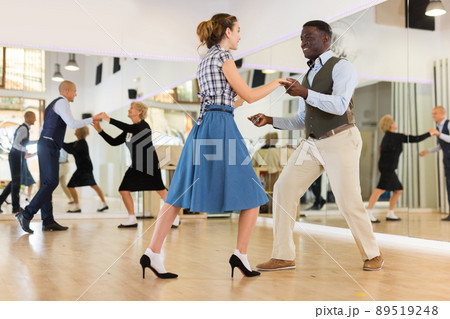 Pair dancing lindy hop during rehearsal 89519248