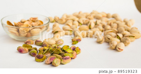 roasted pistachios on white background roasted pistachios on white background 89519323