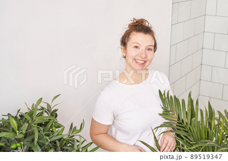 Young woman indoors. Home vacation portrait. Blogger selfie video. Alone Young woman indoors. Home vacation portrait. Blogger selfie video. Alone 89519347