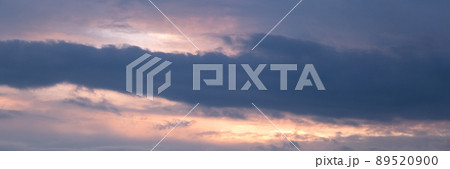 Beautiful dramatic evening sky in blue, yellow and orange colors. Sunset sky. Long banner Beautiful dramatic evening sky in blue, yellow and orange colors. Sunset sky. Long banner 89520900