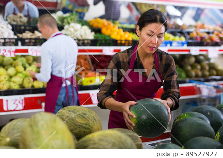 Supermarket workers in salesroom Supermarket workers in salesroom 89527927