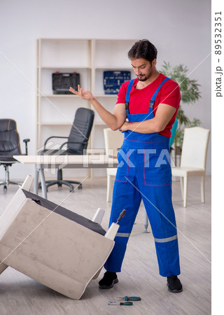 Young male carpenter working at workshop Young male carpenter working at workshop 89532351
