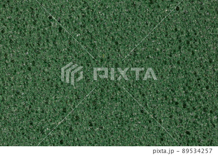 Darkened green foam EVA texture with porosity on surface. 89534257