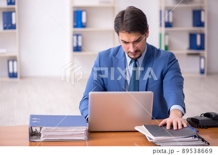 Young businessman employee working in the office Young businessman employee working in the office 89538669