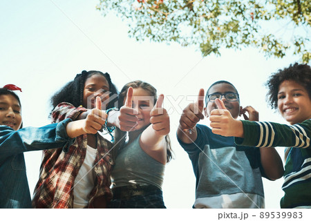 Our favourite summer camp by far. Shot of a group of teenagers showing thumbs up at summer camp. 89539983