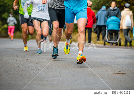 legs group male runners athletes run road 89546131
