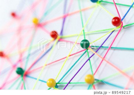 Linking entities, Blockchain, social media, Communications Network, The connection between the two networks. Network simulation on paper linked together by yarn Linking entities, Blockchain, social media, Communications Network, The connection between the two networks. Network simulation on paper linked together by yarn 89549217