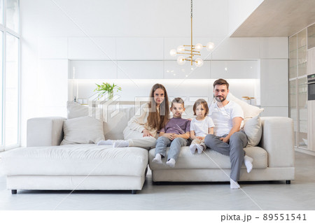 Happy family with children on sofa 89551541