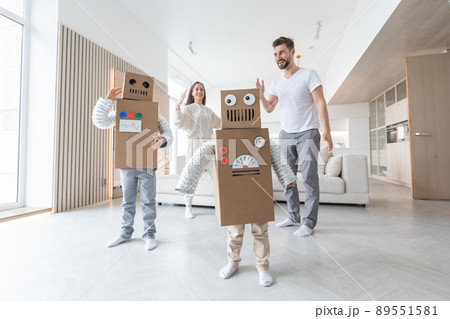Family playing robots at home Family playing robots at home 89551581
