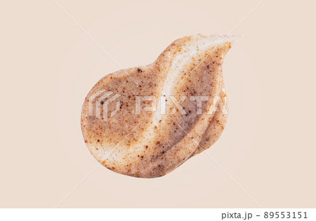 Scrub smear swatch isolated on beige background. Peeling cream smudge with exfoliating particles. Cosmetic skincare product with abrasive particle sample, gentle nude scrub texture. Scrub smear swatch isolated on beige background. Peeling cream smudge with exfoliating particles. Cosmetic skincare product with abrasive particle sample, gentle nude scrub texture. 89553151