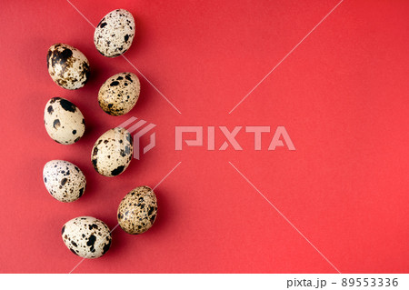 Creative quail egg layout on red background. Happy easter concept. Minimal design. 89553336