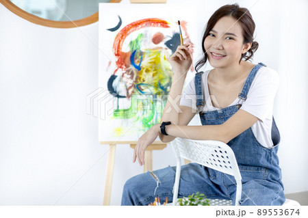 Female artist painting on canvas, Artist studio interior, Draw with watercolor, Drawing supplies , Painting and creativity, Use a brush to draw a pattern by stripes, Artwork, Using Paint Brush. Female artist painting on canvas, Artist studio interior, Draw with watercolor, Drawing supplies , Painting and creativity, Use a brush to draw a pattern by stripes, Artwork, Using Paint Brush. 89553674