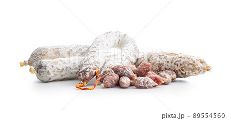 Traditional sausage with white mold. Dried pork salami isolated on white background. Traditional sausage with white mold. Dried pork salami isolated on white background. 89554560