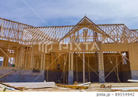 Framed residential home with construction of a timber frame house 89554942