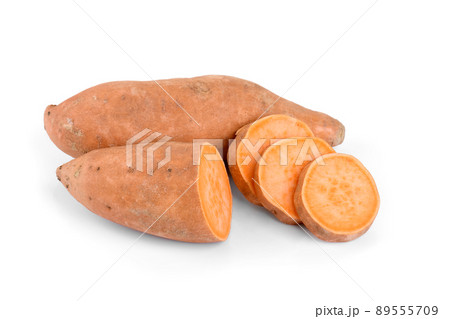 Raw whole orange sweet potato and slices of batatas isolated on white background, closeup 89555709