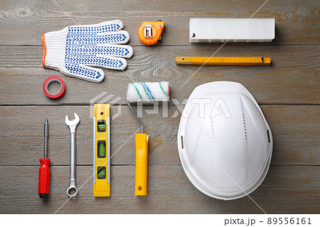 Flat lay composition with different construction tools on wooden background 89556161