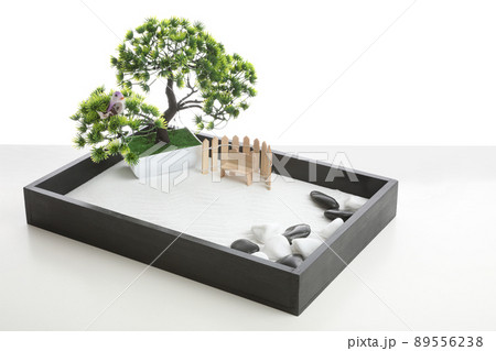 Beautiful miniature zen garden isolated on white Beautiful miniature zen garden isolated on white 89556238