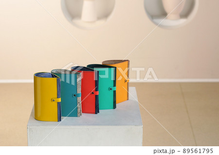 colored leather cosmetic bag assortment close up photo on white wall background colored leather cosmetic bag assortment close up photo on white wall background 89561795