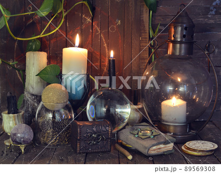 Wicca, esoteric and occult still life with vintage magic objects on witch table altar for mystic rituals and fortune telling. Halloween and gothic concept Wicca, esoteric and occult still life with vintage magic objects on witch table altar for mystic rituals and fortune telling. Halloween and gothic concept 89569308