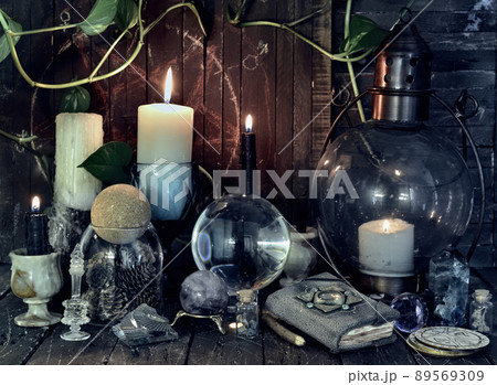 Wicca, esoteric and occult still life with vintage magic objects on witch table altar for mystic rituals and fortune telling. Halloween and gothic concept Wicca, esoteric and occult still life with vintage magic objects on witch table altar for mystic rituals and fortune telling. Halloween and gothic concept 89569309