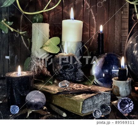 Wicca, esoteric and occult still life with vintage magic objects on witch table altar for mystic rituals and fortune telling. Halloween and gothic concept Wicca, esoteric and occult still life with vintage magic objects on witch table altar for mystic rituals and fortune telling. Halloween and gothic concept 89569311