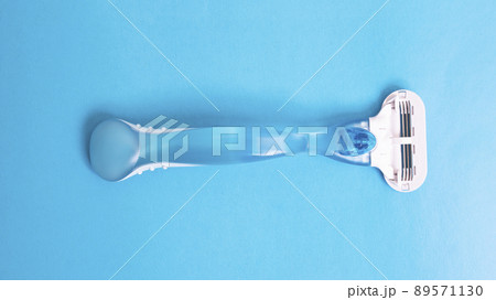 Womens blue razor on a blue background Womens blue razor on a blue background 89571130
