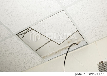 Tiles removed from ceiling and wire sticks out 89571143