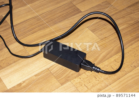 Black extension cord with button and wires 89571144