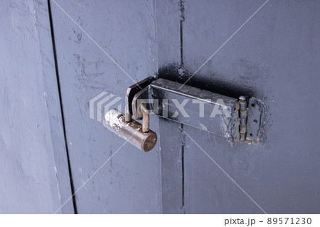 Lock on a black metal door closeup Lock on a black metal door closeup 89571230
