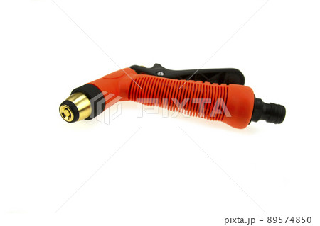 Hose nozzle spraying water isolated on white background. 89574850