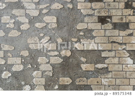 full-frame background and texture of damaged brick pavement 89575348