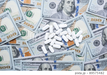 Pills on the background of the dollar close-up. Pills on the background of the dollar close-up. 89575482