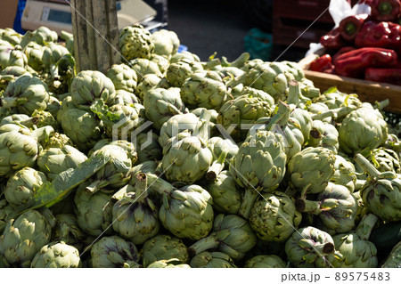 Artichoke in boxes at the bazaar close-up. Artichoke in boxes at the bazaar close-up. 89575483