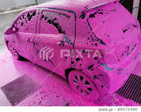 Car wash at home. The car is covered with foam to remove dirt 89575490