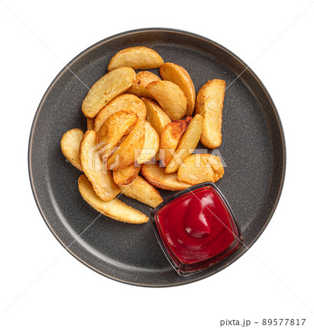 Isolated plate of baked potato wedges 89577817