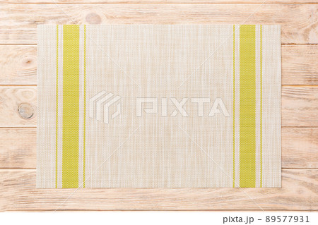 Top view of green tablecloth for food on wooden background. Empty space for your design 89577931