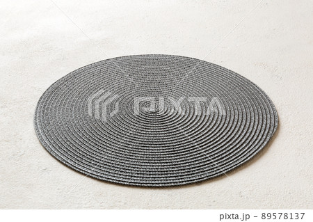 Perspective view of round tablecloth for food on cement background. Empty space for your design 89578137