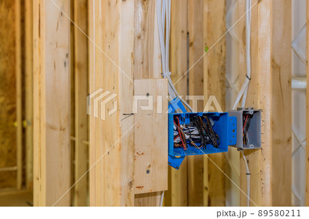 Installing electric sockets on the wall new home new home construction 89580211