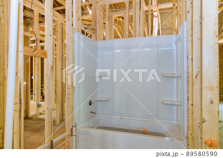 Installed a new bathtub for a new bathroom in new house 89580590