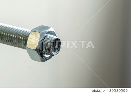 Stainless steel bolts and nuts on a white background. Bolt, washer and nut on a white background. Bolt on a white background. Bolt screw nut washer carving. Stainless steel bolts and nuts on a white background. Bolt, washer and nut on a white background. Bolt on a white background. Bolt screw nut washer carving. 89580596