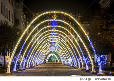 Night view of New Year or Christmas decorative arches with bright lights during winter holidays in Ivano-Frankivsk city, Ukraine. Night view of New Year or Christmas decorative arches with bright lights during winter holidays in Ivano-Frankivsk city, Ukraine. 89580846
