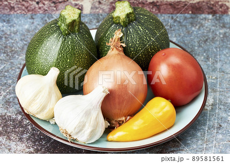 Fresh organic vegetables on a plate. Vegetarian and Vegan Fresh organic vegetables on a plate. Vegetarian and Vegan 89581561