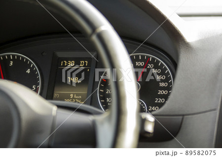 Close up interior view of modern luxurious black car. Dashboard, steering wheel, speedometer. Speed, comfort and luxury. Close up interior view of modern luxurious black car. Dashboard, steering wheel, speedometer. Speed, comfort and luxury. 89582075
