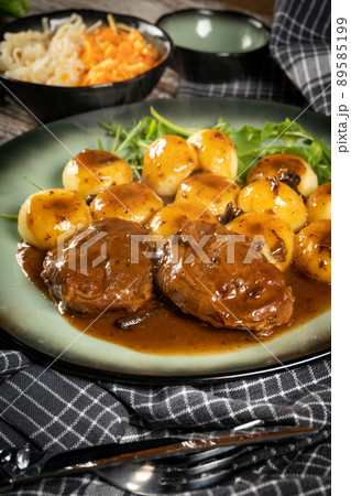 Traditional German braised pork cheeks in brown sauce. Traditional German braised pork cheeks in brown sauce. 89585199