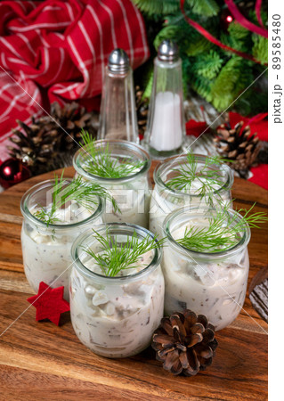 Pieces of herring in yoghurt. 89585480