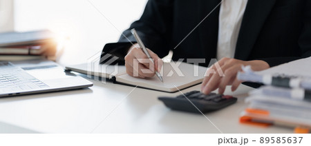 Bookkeeper or financial inspector hands making report, calculating. Home finances, investment, economy, saving money or insurance concept. Bookkeeper or financial inspector hands making report, calculating. Home finances, investment, economy, saving money or insurance concept. 89585637