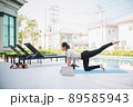 Happy asian woman stretching exercise and yoga workout in the morning at home Happy asian woman stretching exercise and yoga workout in the morning at home 89585943