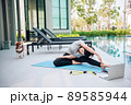 Happy asian woman stretching exercise and yoga workout in the morning at home Happy asian woman stretching exercise and yoga workout in the morning at home 89585944