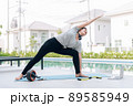 Happy asian woman stretching exercise and yoga workout in the morning at home Happy asian woman stretching exercise and yoga workout in the morning at home 89585949