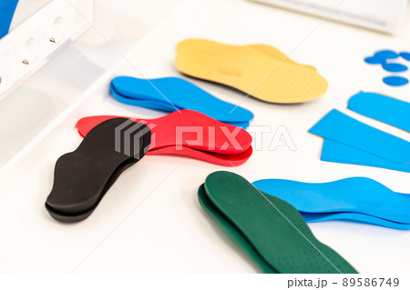 Orthopedic insole. The orthopedist works with the patient. Orthopedic clinic. Choice of insoles in an orthopedic clinic. The orthopedist offers the insole to the patient Foot care 89586749